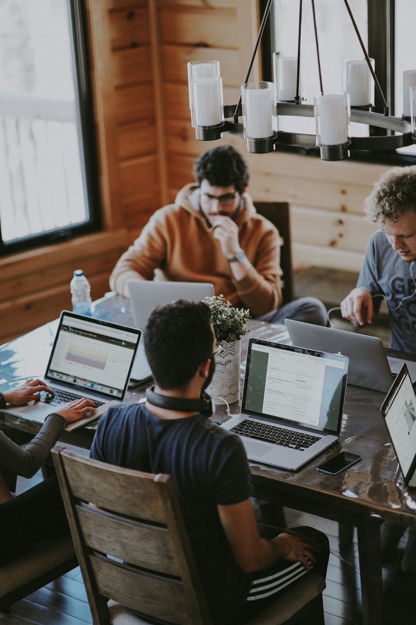 Colleagues collaborating around a table in a bright workspace